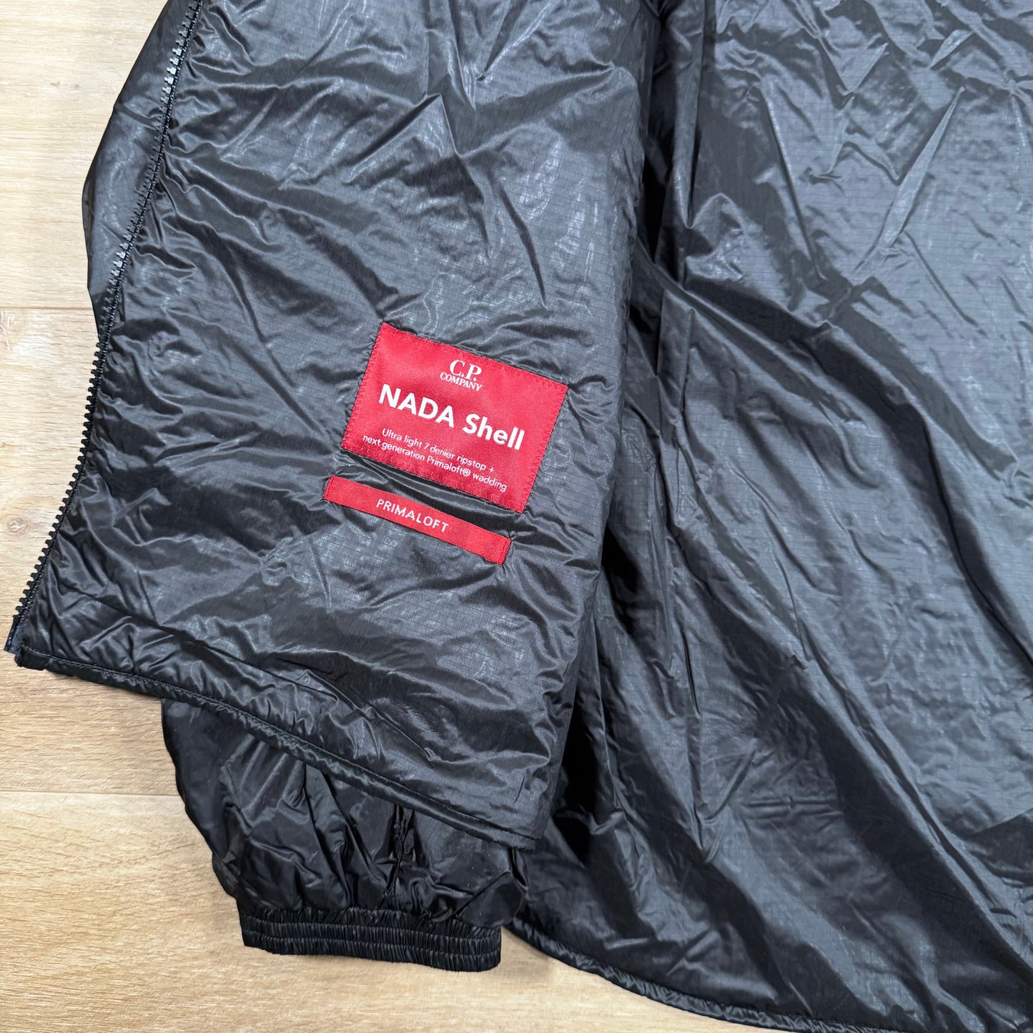 C.P. Company Nada Shell Lens Padded Jacket in Black