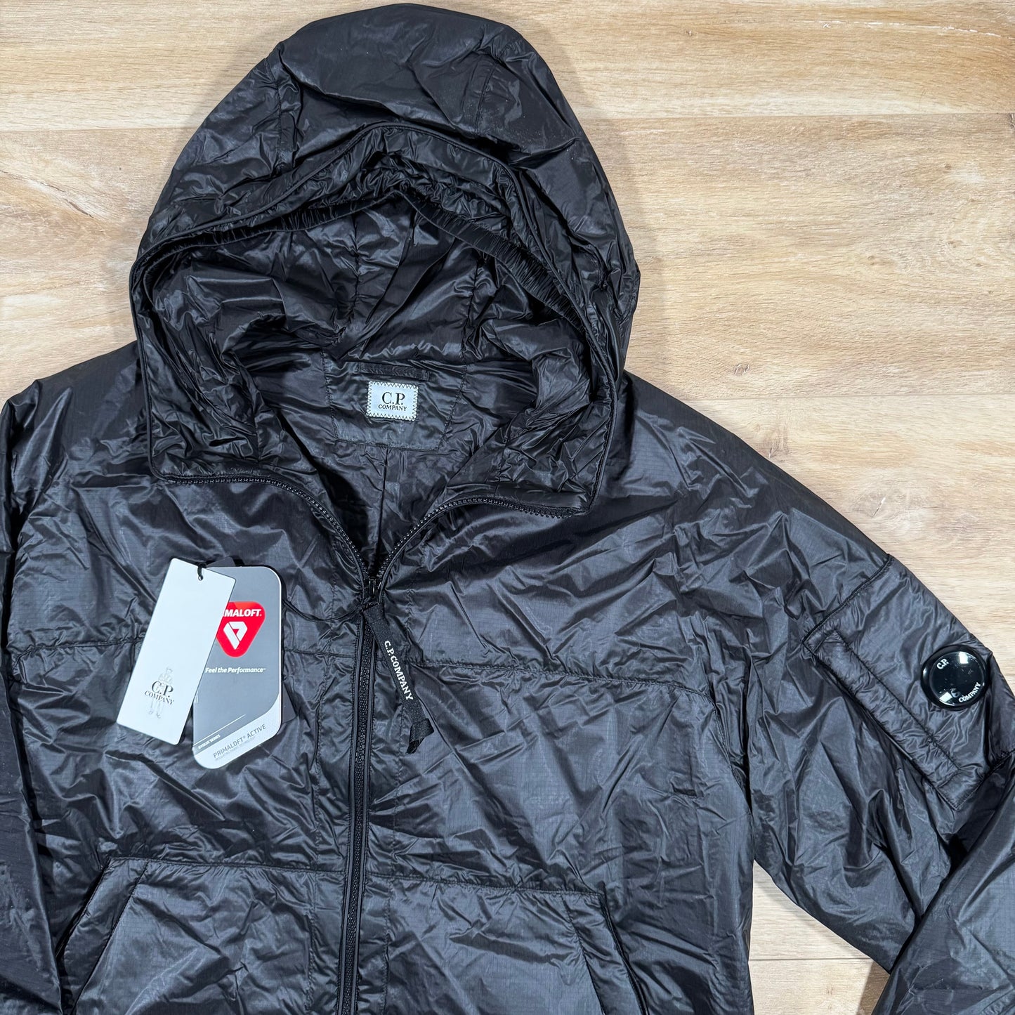 C.P. Company Nada Shell Lens Padded Jacket in Black