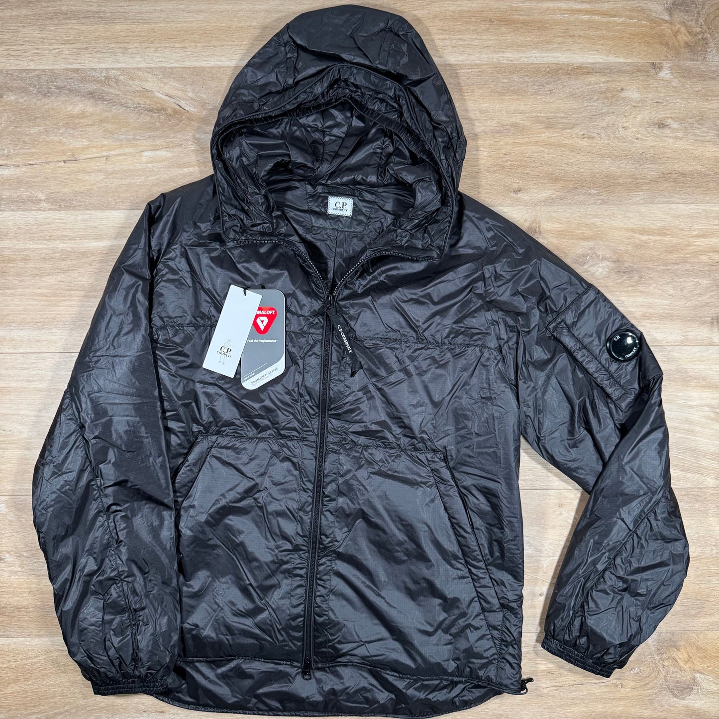 C.P. Company Nada Shell Lens Padded Jacket in Black