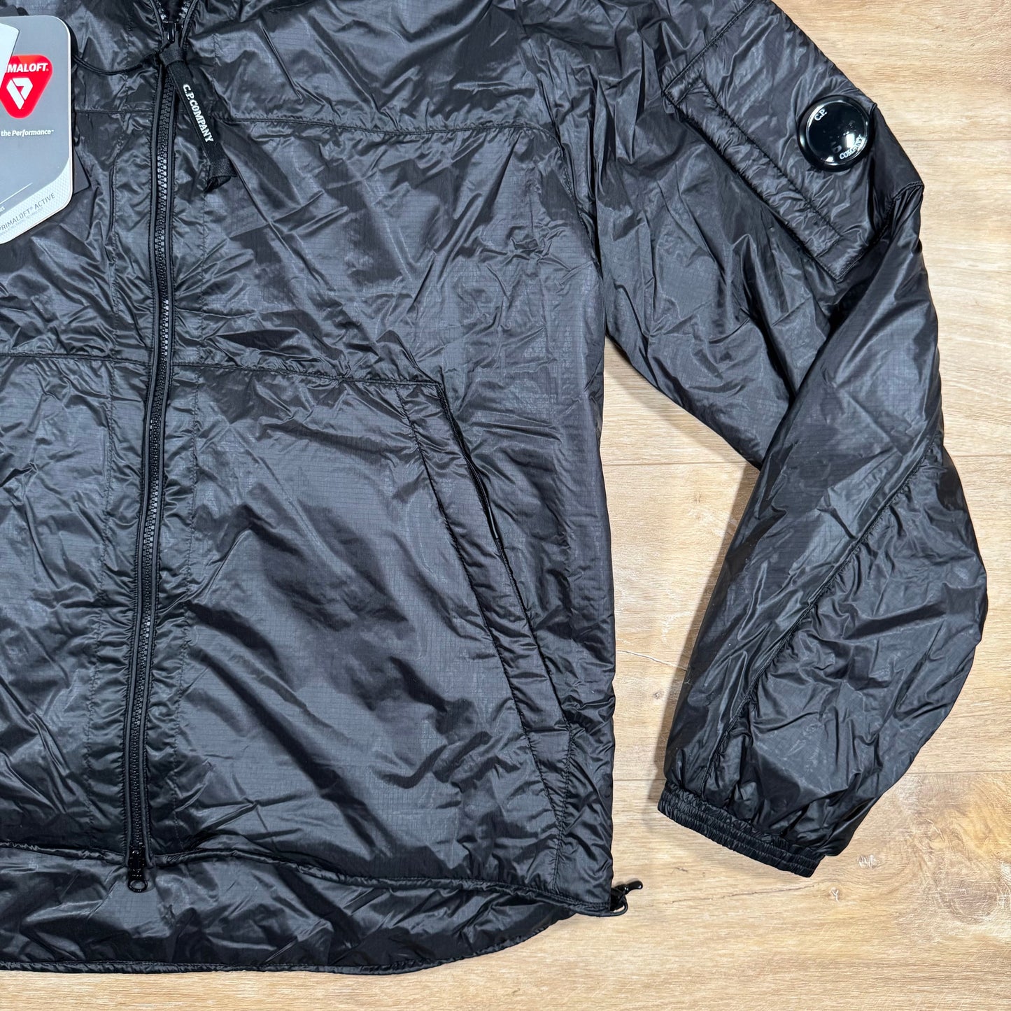 C.P. Company Nada Shell Lens Padded Jacket in Black