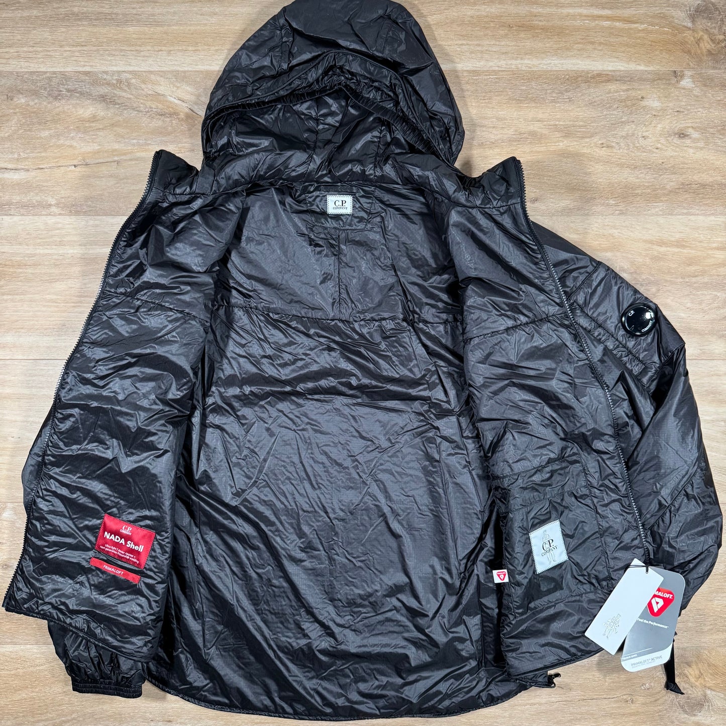 C.P. Company Nada Shell Lens Padded Jacket in Black
