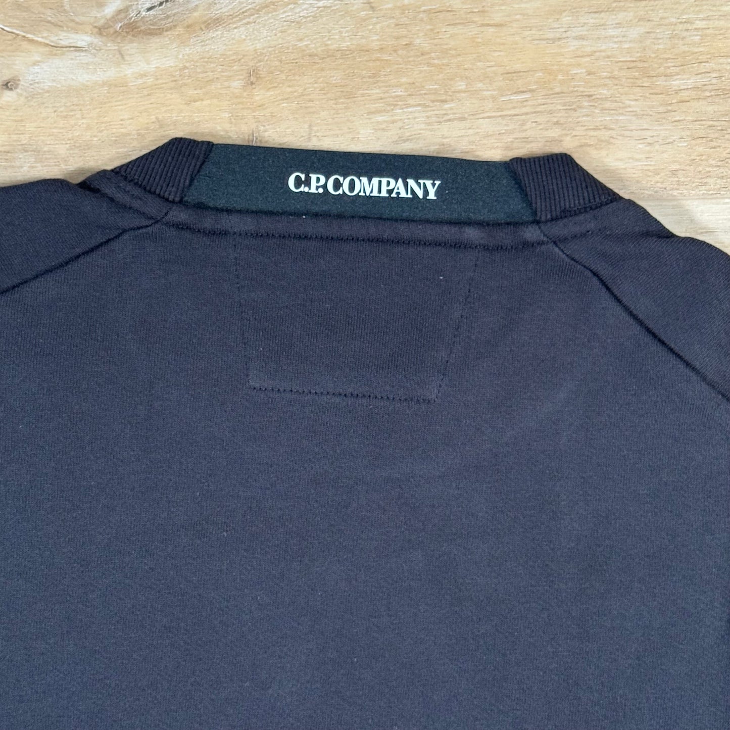 C.P. Company Diagonal Raised Fleece Crewneck Lens Sweatshirt in Black