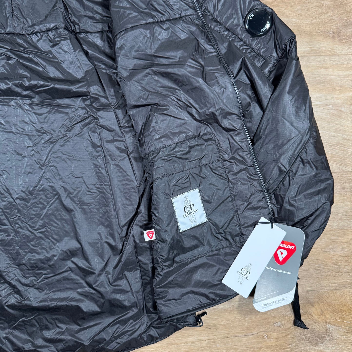 C.P. Company Nada Shell Lens Padded Jacket in Black