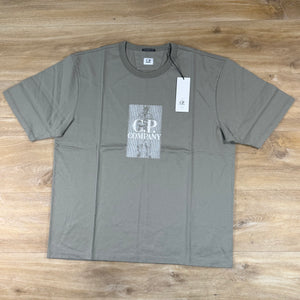 C.P. Company Mercerized Jersey Twisted Chest Logo T-Shirt in Fallen Rock - Beige