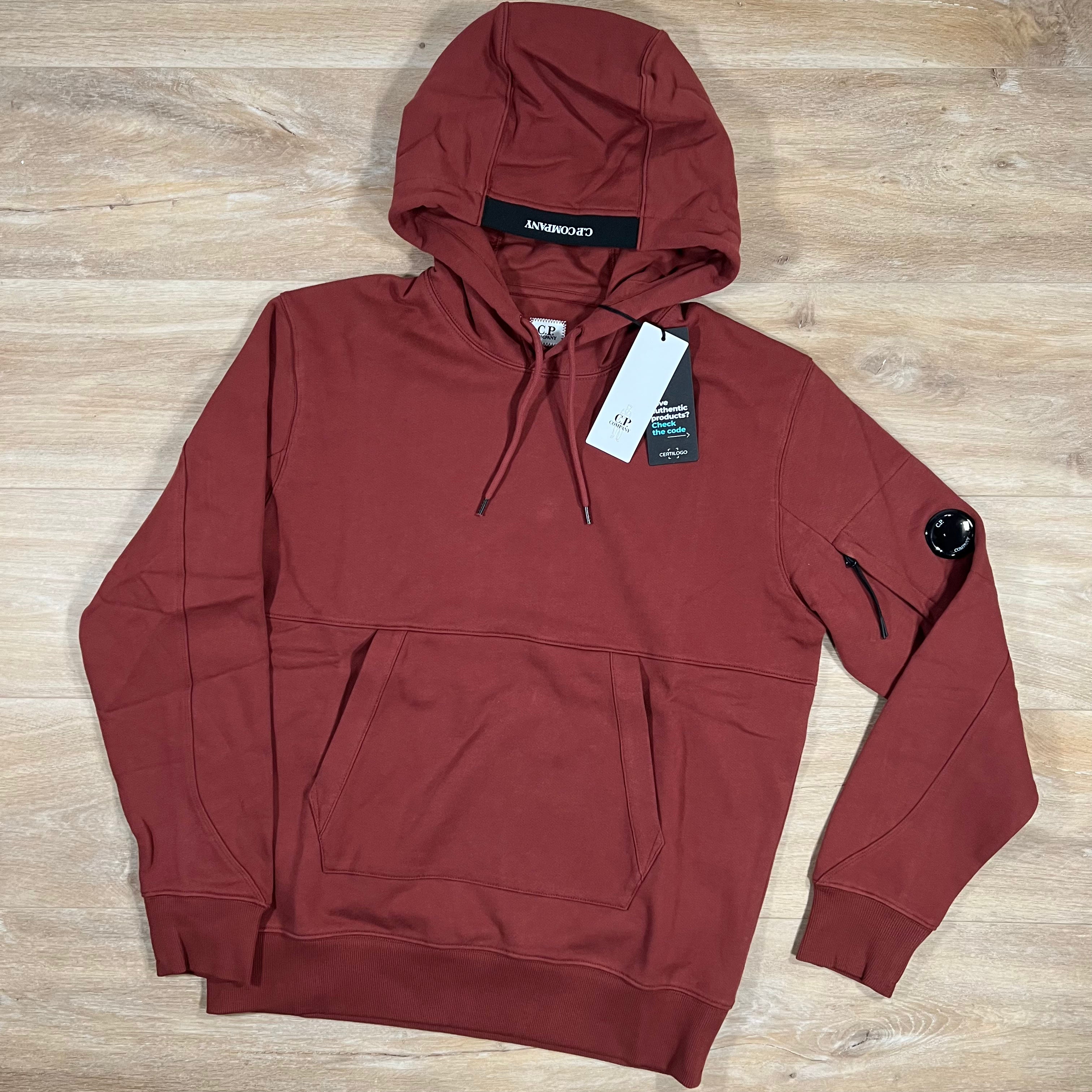 C.P. Company Diagonal Raised Lens Hoodie in Henna Red LABEL MENSWEAR