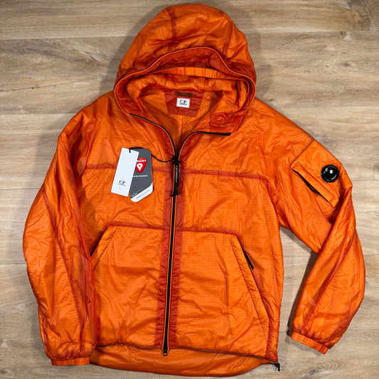 C.P. Company Nada Shell Lens Padded Jacket in Russet Orange