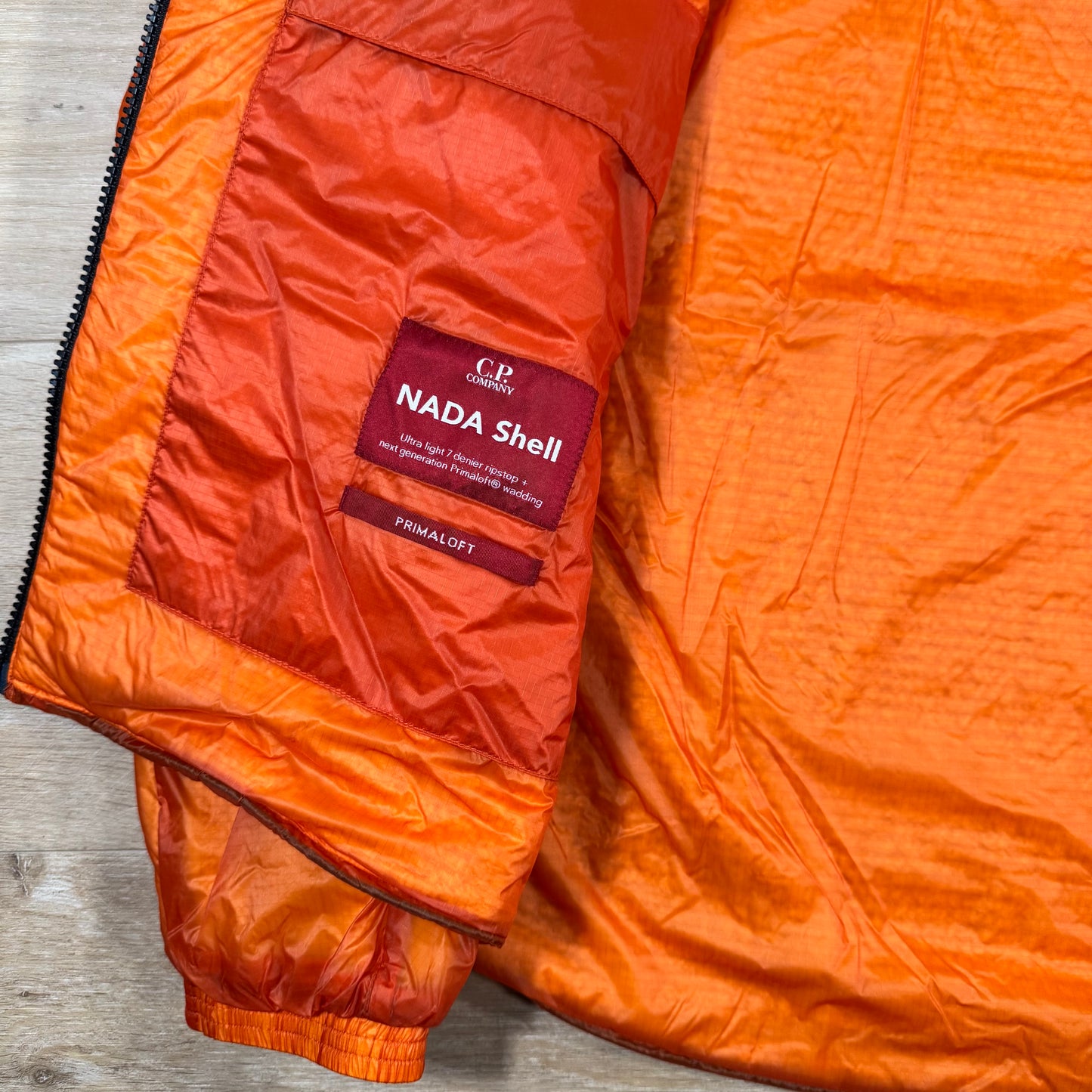 C.P. Company Nada Shell Lens Padded Jacket in Russet Orange