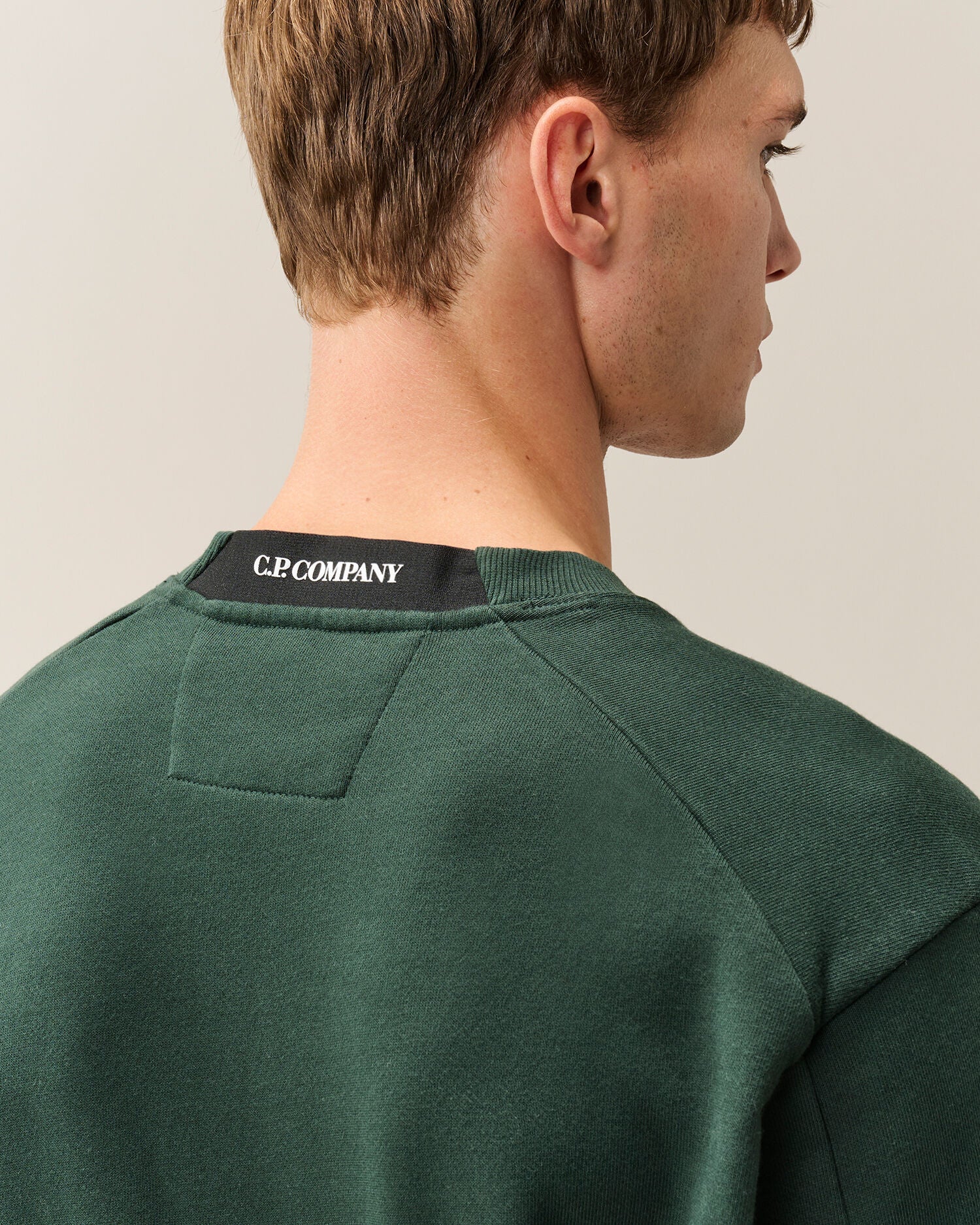 C.P. Company Diagonal Raised Fleece Crewneck Lens Sweatshirt in Ponderosa Pine - Green