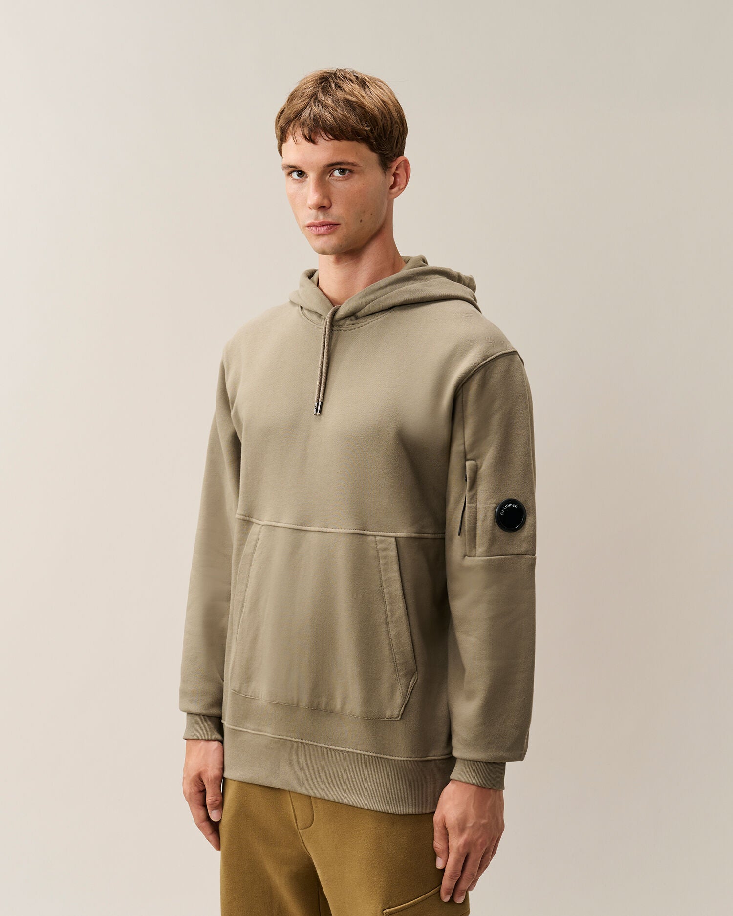 C.P. Company Diagonal Raised Fleece Lens Hoodie in Fallen Rock - Beige