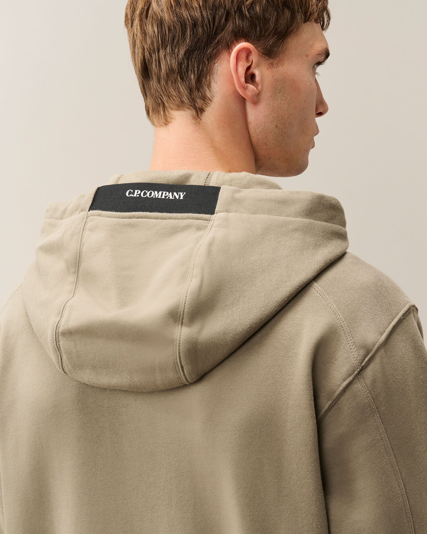 C.P. Company Diagonal Raised Fleece Lens Hoodie in Fallen Rock - Beige