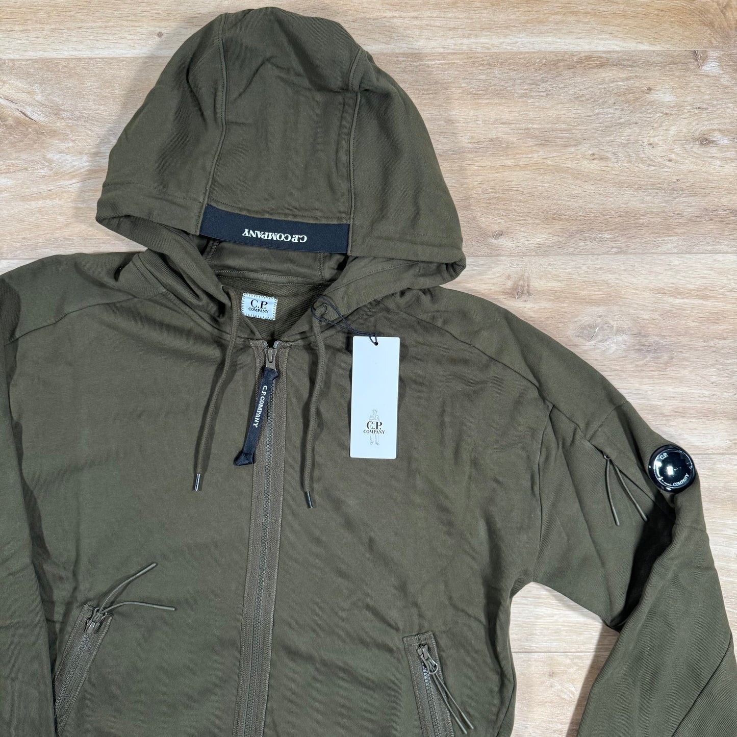 C.P. Company Diagonal Raised Zipped Lens Hoodie in Ivy Green