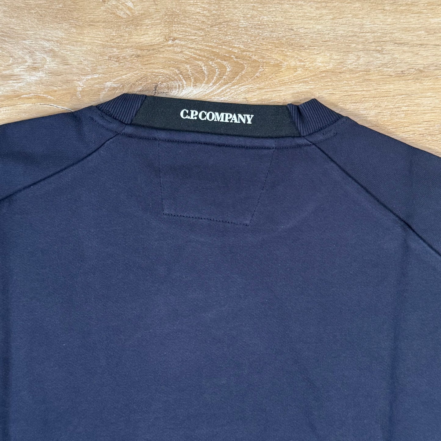 C.P. Company Diagonal Raised Fleece Crewneck Lens Sweatshirt in Navy