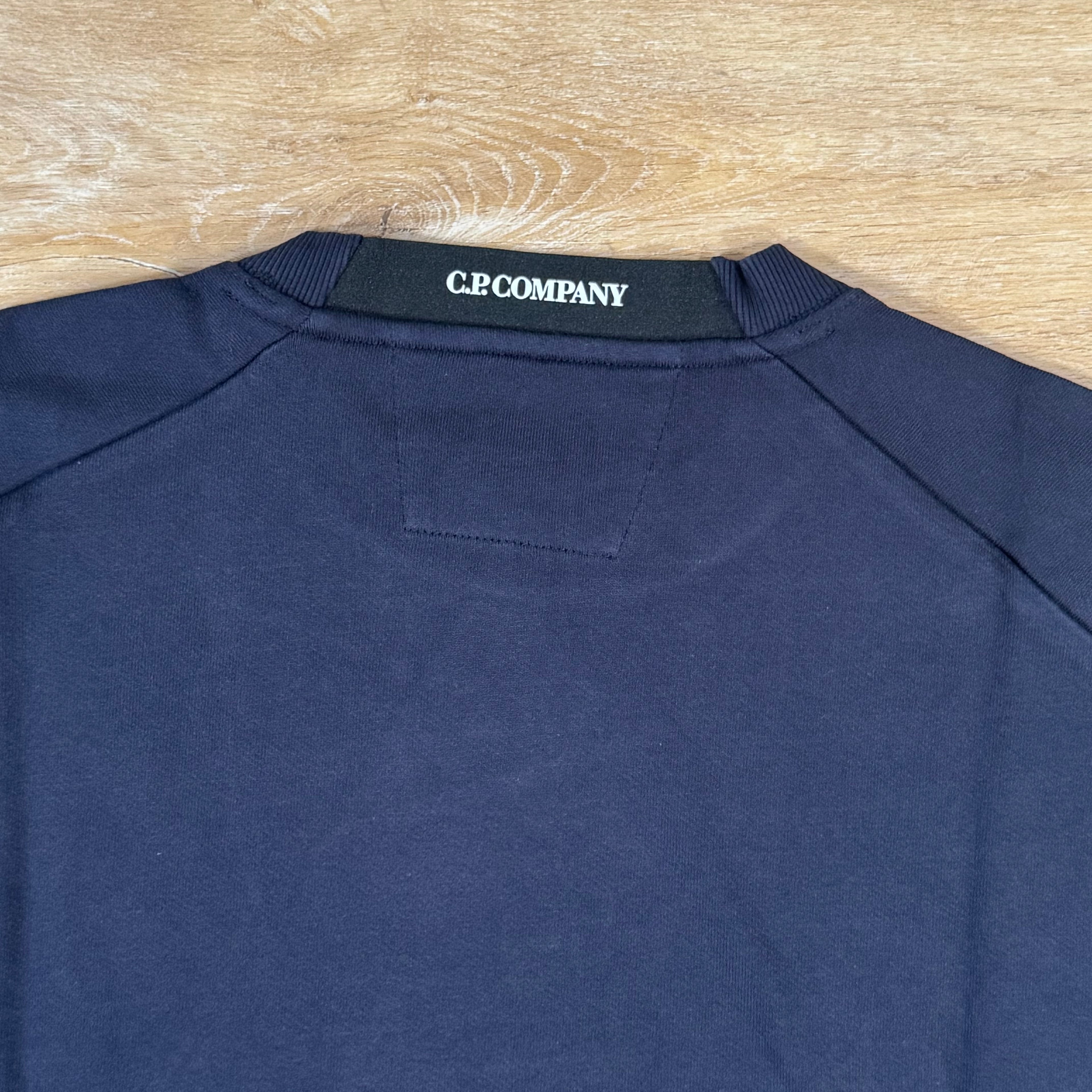 C.P. Company Diagonal Raised Fleece Crewneck Lens Sweatshirt in Navy