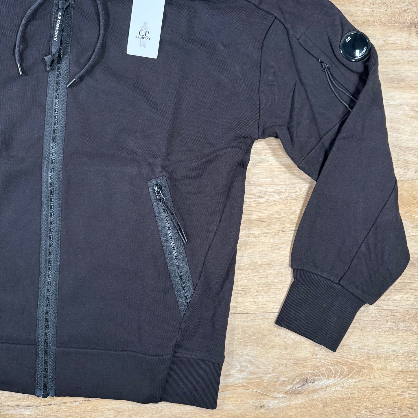 C.P. Company Diagonal Raised Zipped Lens Hoodie in Black