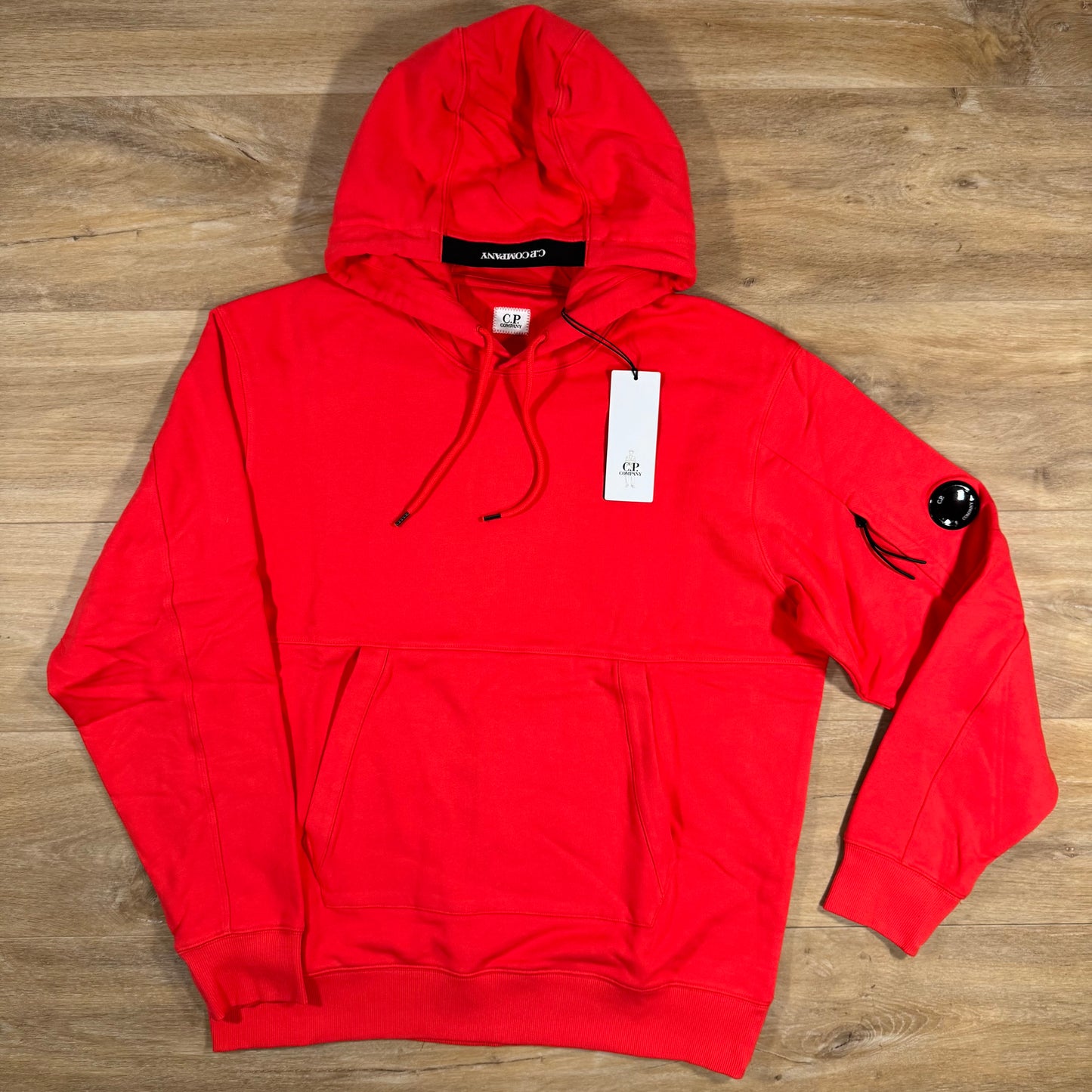 C.P. Company Diagonal Raised Fleece Lens Hoodie in Poinciana Orange