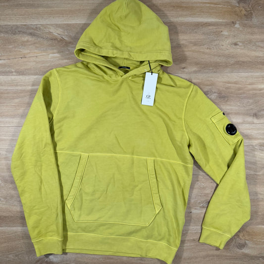 C.P. Company Garment Dyed Lens Hoodie in Golden Palm