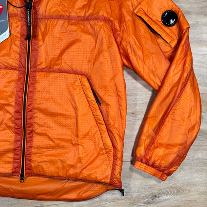 C.P. Company Nada Shell Lens Padded Jacket in Russet Orange