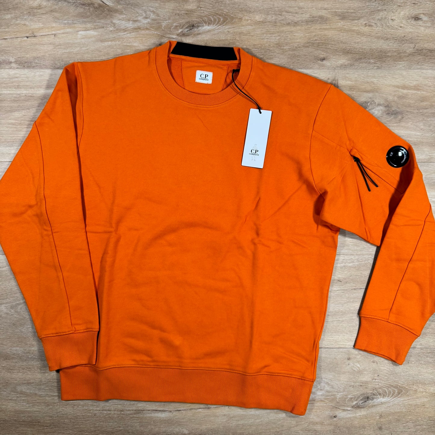 C.P. Company Diagonal Raised Fleece Crewneck Lens Sweatshirt in Russet Orange