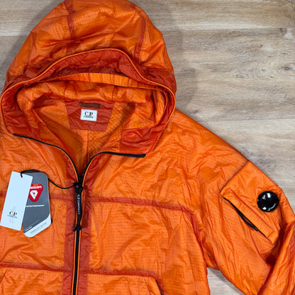 C.P. Company Nada Shell Lens Padded Jacket in Russet Orange