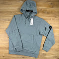 C.P. Company Diagonal Raised Fleece Lens Hoodie in Silver Blue