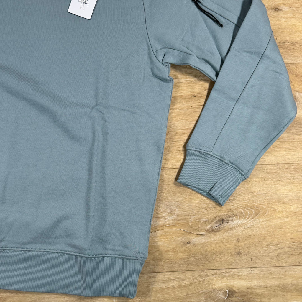 C.P. Company Diagonal Raised Fleece Crewneck Lens Sweatshirt in Silver Blue