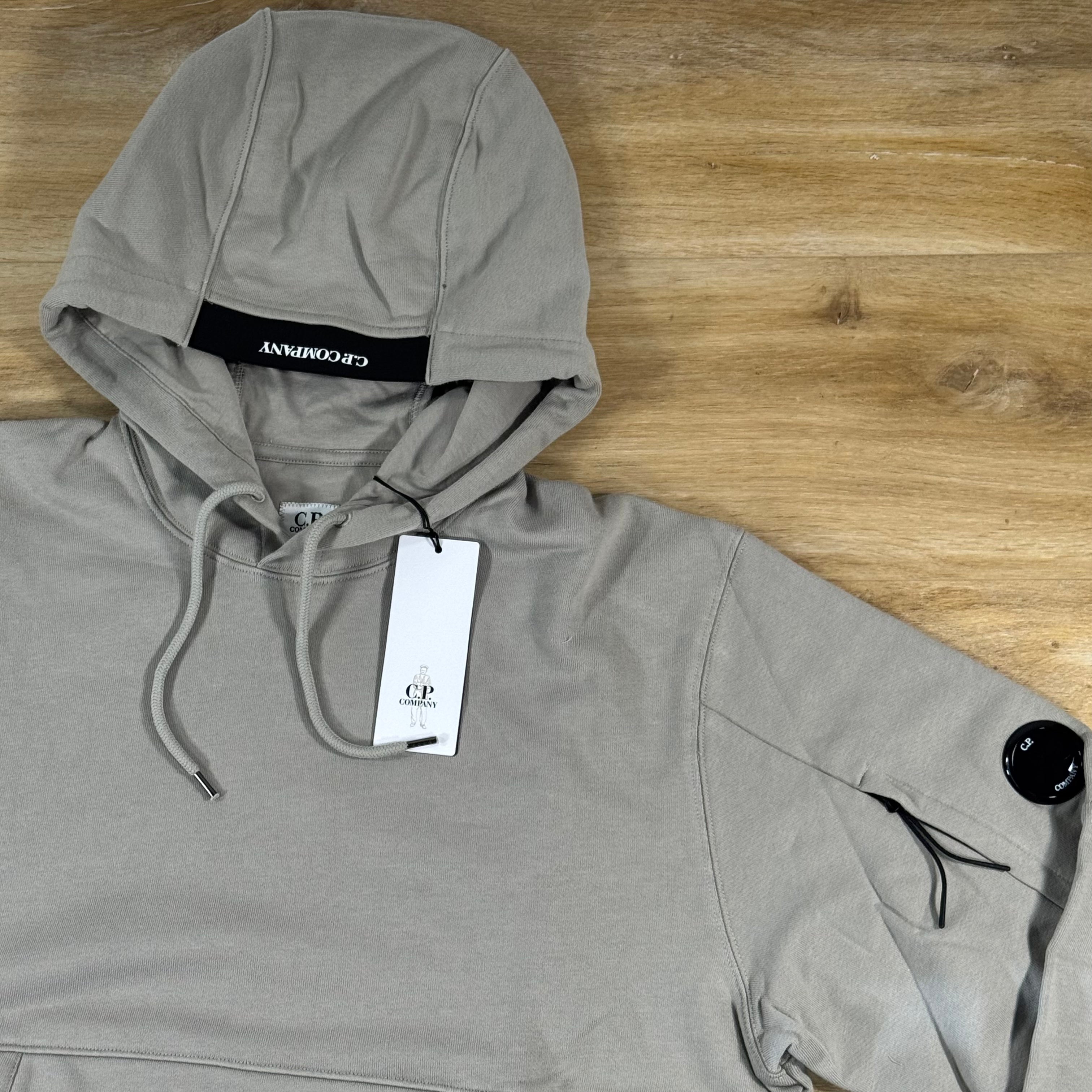 C.P. Company Diagonal Raised Fleece Lens Hoodie in Dove
