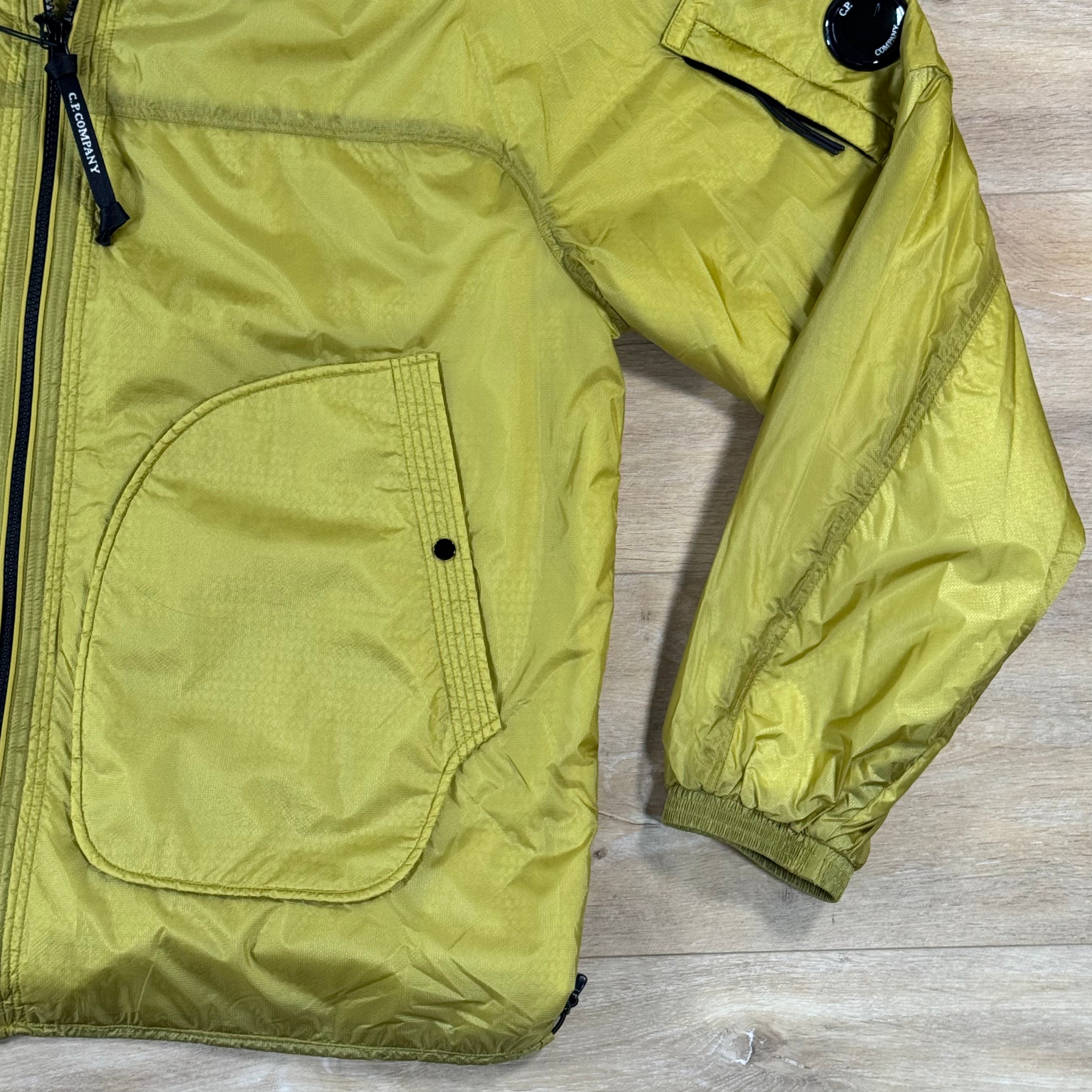 C.P. Company Nada Shield Packable Primaloft Evolve Lens Jacket in Antique Moss - Yellow