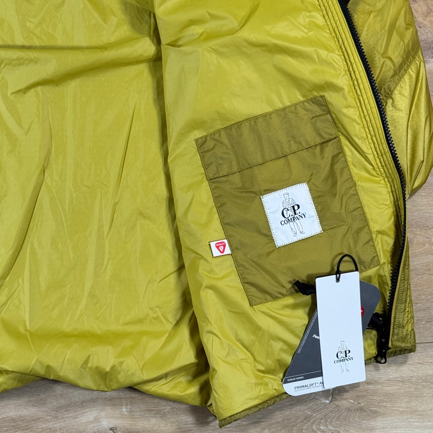 C.P. Company Nada Shield Packable Primaloft Evolve Lens Jacket in Antique Moss - Yellow