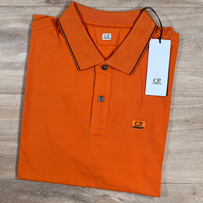 C.P. Company Stretch Piquet Striped Collar Polo Shirt in Russet Orange