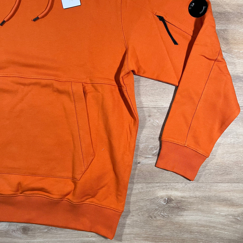 C.P. Company Diagonal Raised Fleece Lens Hoodie in Russet Orange