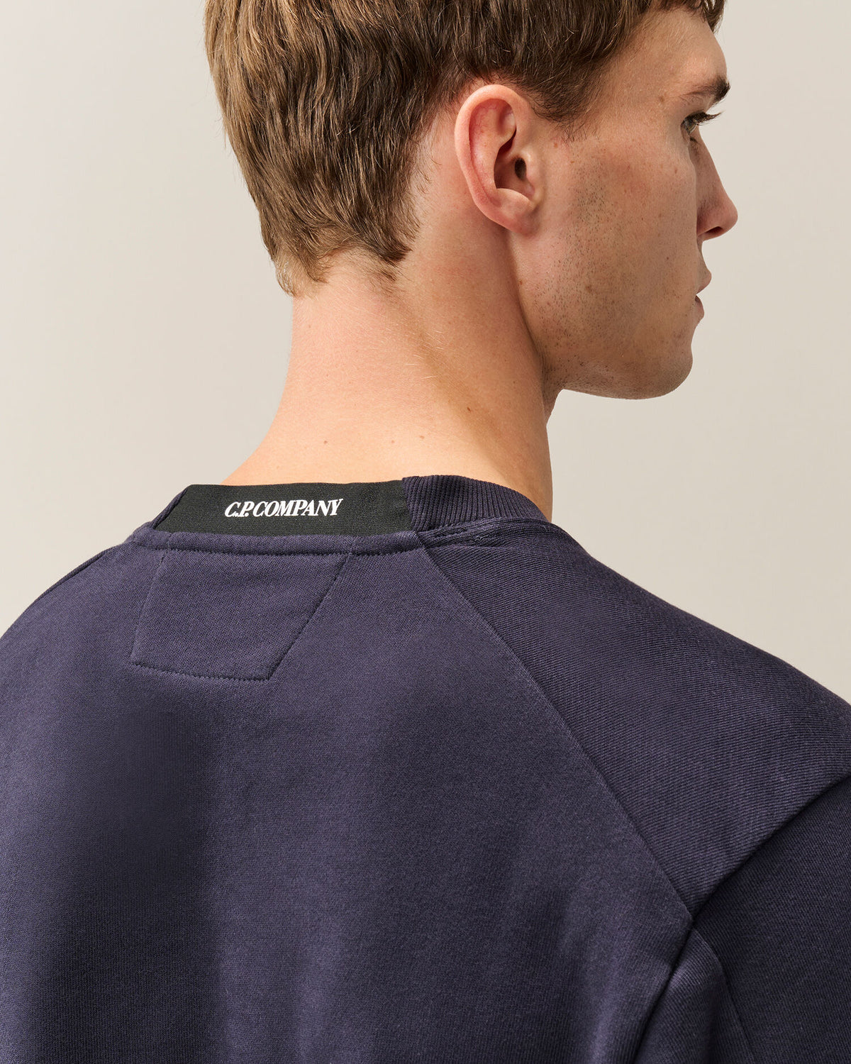 C.P. Company Diagonal Raised Fleece Crewneck Lens Sweatshirt in Navy