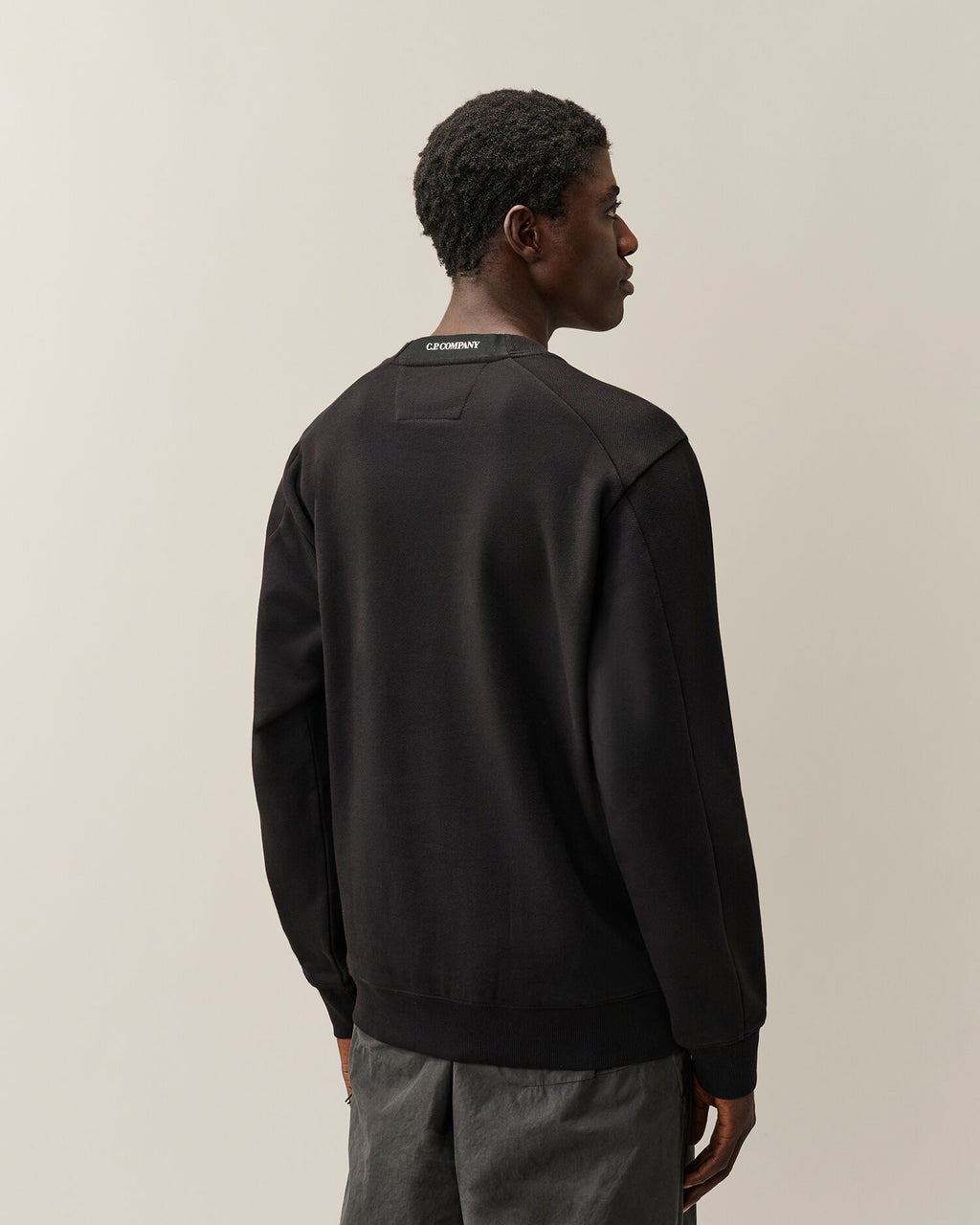 C.P. Company Diagonal Raised Fleece Crewneck Lens Sweatshirt in Black