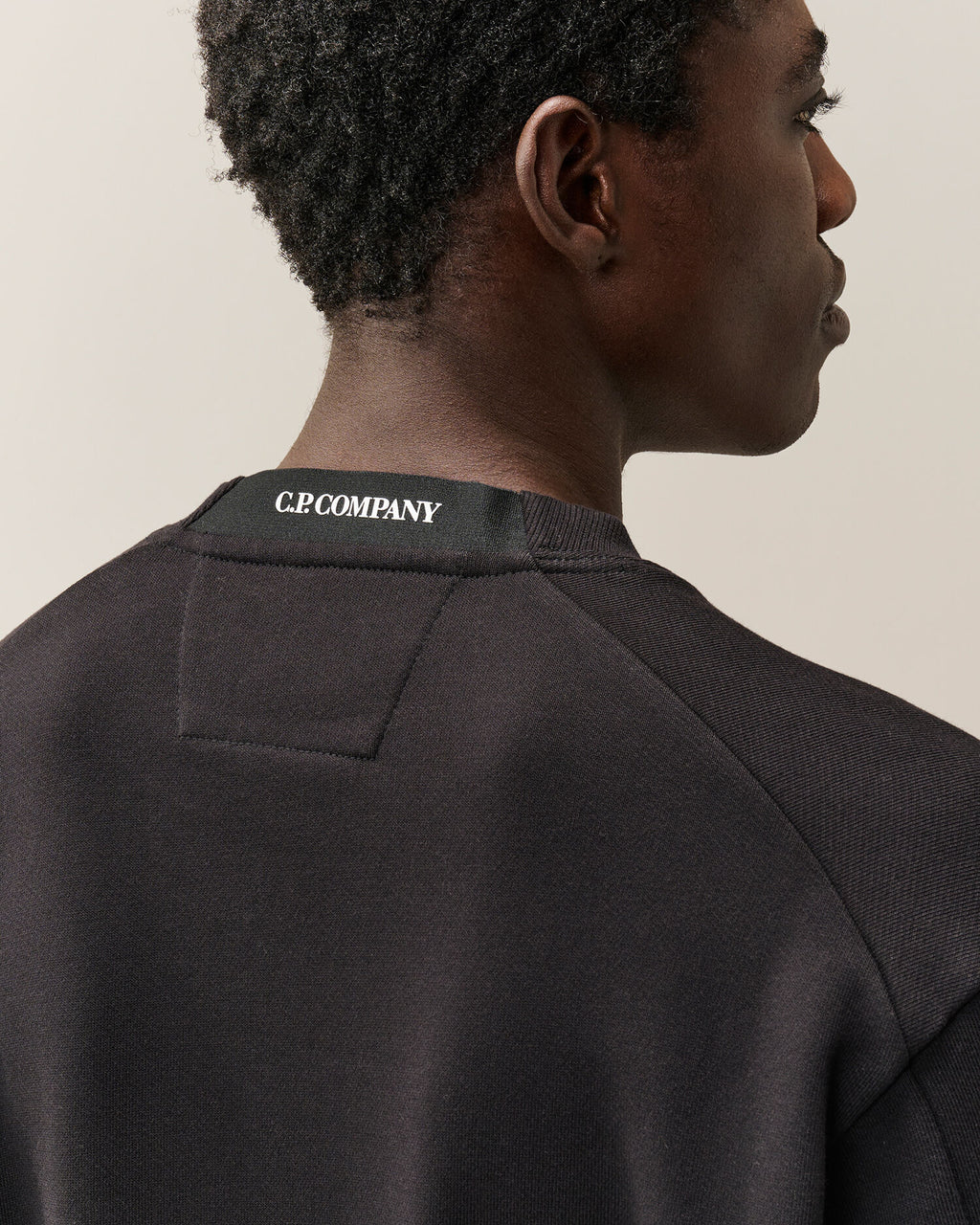 C.P. Company Diagonal Raised Fleece Crewneck Lens Sweatshirt in Black