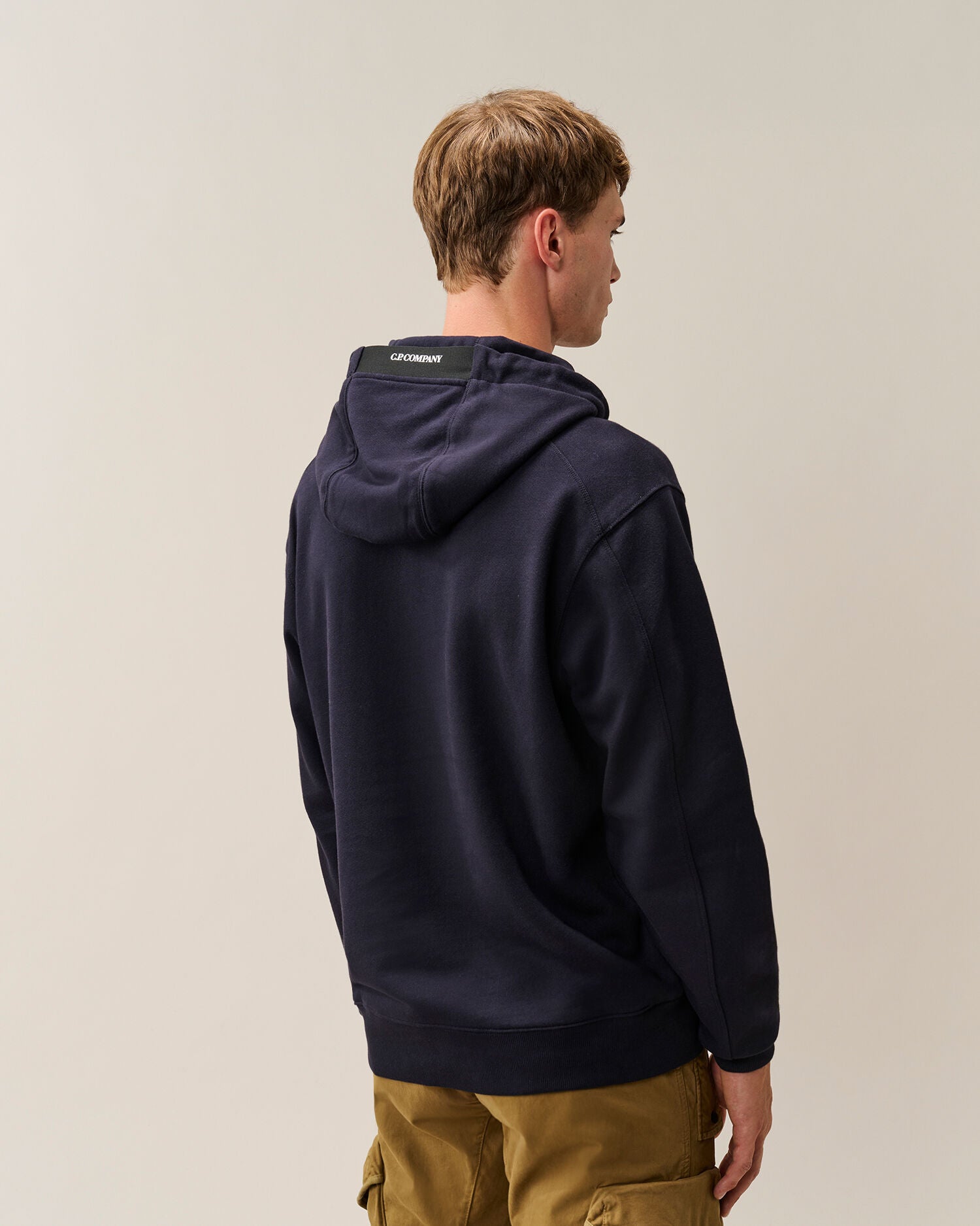 C.P. Company Diagonal Raised Fleece Lens Hoodie in Navy