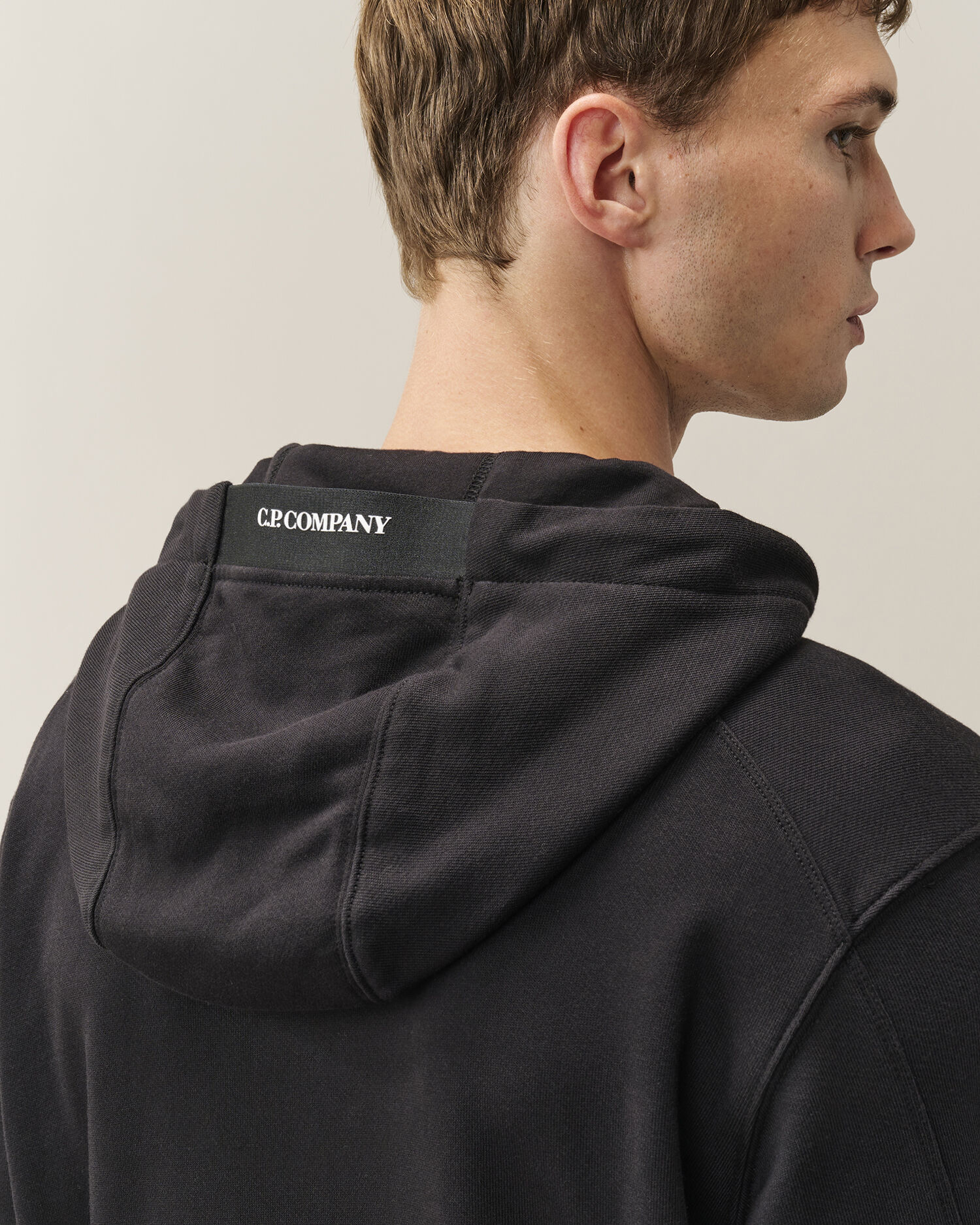 C.P. Company Diagonal Raised Fleece Lens Hoodie in Black