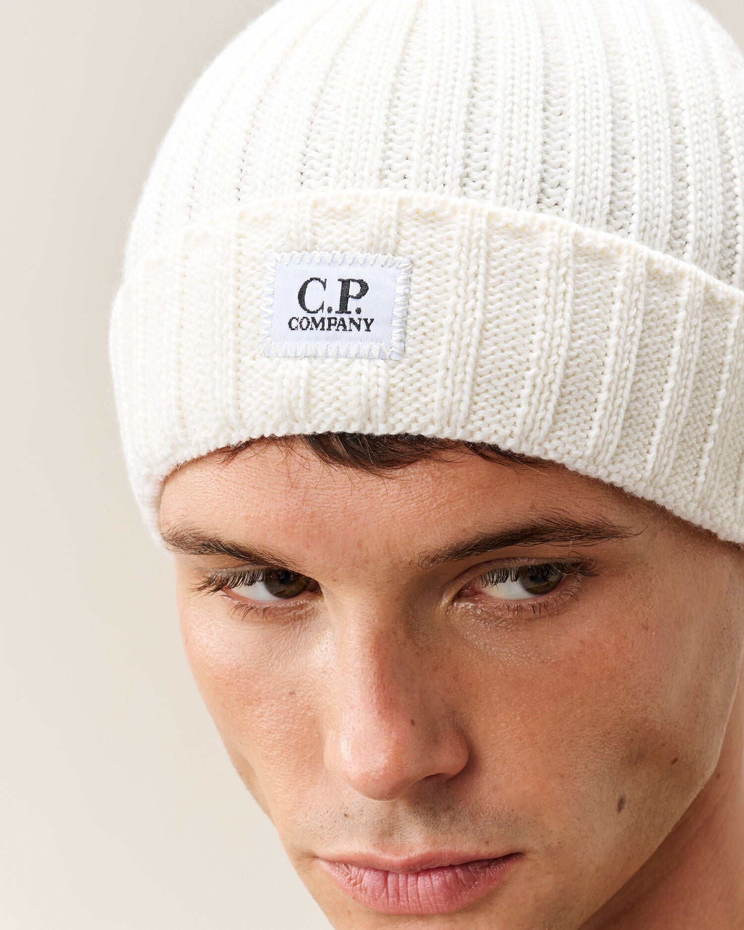 C.P. Company Extra Fine Merino Wool Logo Beanie in Gauze White